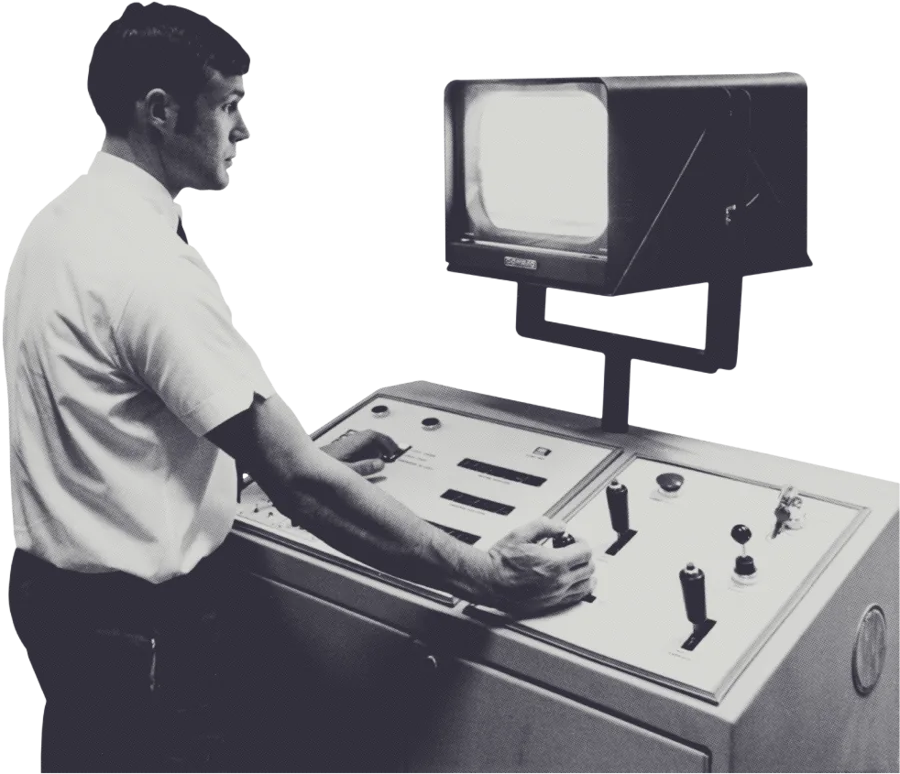 An engineer at a control-room console